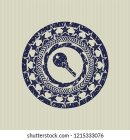 Blue key icon inside distress grunge stamp