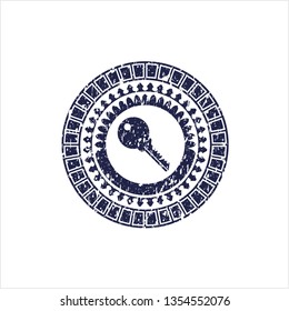 Blue key icon inside distressed rubber seal