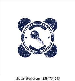 Blue key icon inside rubber grunge stamp