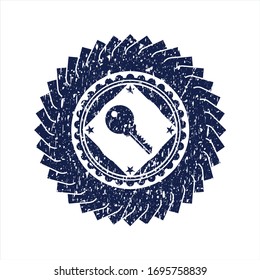 Blue key icon inside rubber stamp