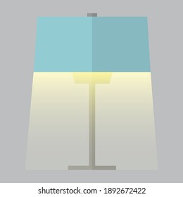 Una lámpara azul ilumina la luz sobre un fondo gris.