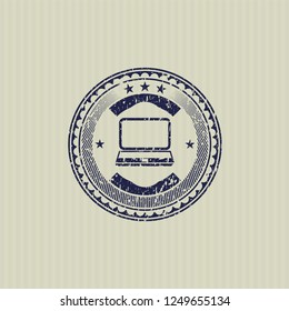 Blue laptop icon inside distressed rubber grunge texture seal