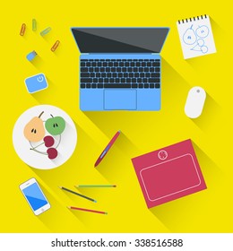 blue laptop & pink graphics tablet on yellow background