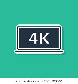 Blue Laptop screen with 4k video technology icon isolated on green background.  Vector Illustration