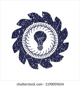 Blue light bulb icon inside distressed grunge style stamp