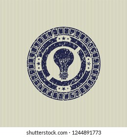 Blue light bulb icon inside distress rubber grunge seal