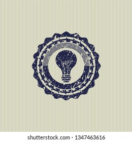 Blue light bulb icon inside distress rubber texture