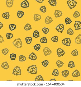 Blue line Animal health insurance icon isolated seamless pattern on yellow background. Pet protection icon. Dog or cat paw print.  Vector Illustration