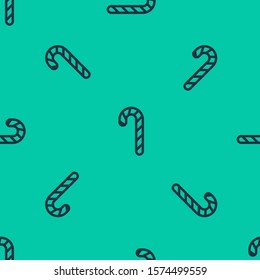 Blue line Christmas candy cane with stripes icon isolated seamless pattern on green background. Merry Christmas and Happy New Year.  Vector Illustration