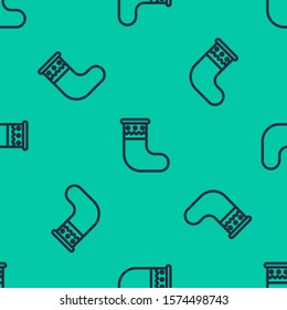 Blue line Christmas stocking icon isolated seamless pattern on green background. Merry Christmas and Happy New Year.  Vector Illustration