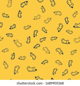 Blue line Christmas stocking icon isolated seamless pattern on yellow background. Merry Christmas and Happy New Year.  Vector Illustration