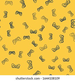 Blue line Gamepad icon isolated seamless pattern on yellow background. Game controller.  Vector Illustration