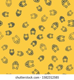 Blue line Horseshoe with four leaf clover icon isolated seamless pattern on yellow background. Happy Saint Patricks day.  Vector Illustration