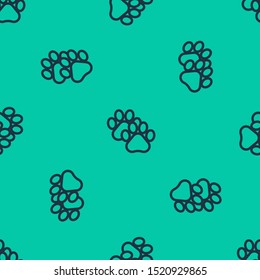 Blue line Paw print icon isolated seamless pattern on green background. Dog or cat paw print. Animal track.  Vector Illustration
