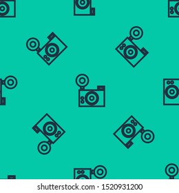Blue line Photo camera icon isolated seamless pattern on green background. Foto camera icon.  Vector Illustration