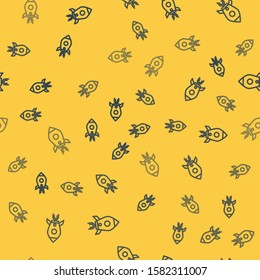 Blue line Rocket ship with fire icon isolated seamless pattern on yellow background. Space travel.  Vector Illustration