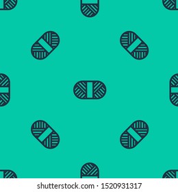 Blue line Sewing thread on spool icon isolated seamless pattern on green background. Yarn spool. Thread bobbin.  Vector Illustration