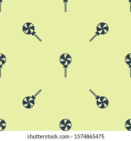 Blue Lollipop icon isolated seamless pattern on yellow background. Candy sign. Food, delicious symbol.  Vector Illustration