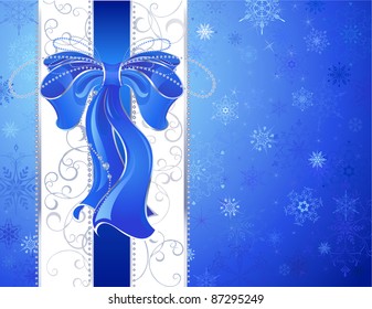 blue, luxurious, silk ribbon with a white ribbon on a blue patterned, snow, christmas background.