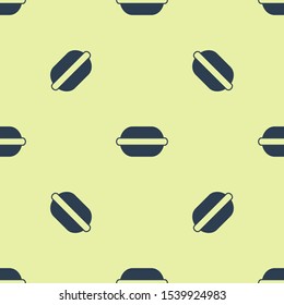 Blue Macaron cookie icon isolated seamless pattern on yellow background. Macaroon sweet bakery.  Vector Illustration