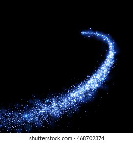 Blue magic light trail of glittering comet tail. Glowing glitter sparkles. Shining diamond spray isolated on black background