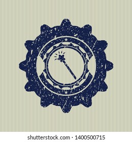 Blue magic stick icon inside rubber grunge texture stamp