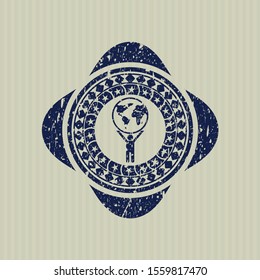 Blue man lifting world icon inside distress rubber texture