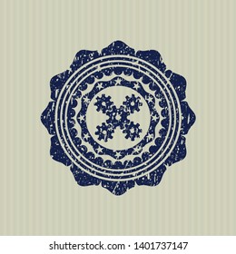 Blue mechanism icon inside rubber grunge texture seal