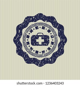 Blue medical briefcase icon inside distressed rubber grunge seal