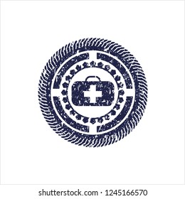 Blue medical briefcase icon inside distress rubber grunge texture stamp