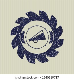 Blue megaphone icon inside rubber stamp