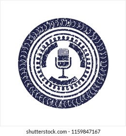 Blue microphone icon inside rubber stamp with grunge texture