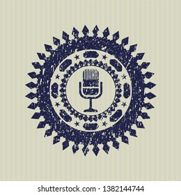 Blue microphone icon inside rubber grunge seal