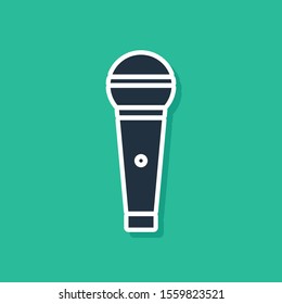 Blue Microphone icon isolated on green background. On air radio mic microphone. Speaker sign.  Vector Illustration