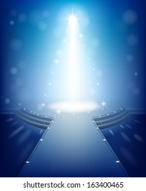 Blue modern interior with a Christmas tree. The scene illuminated by spotlights