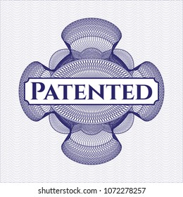 Blue money style rosette with text Patented inside