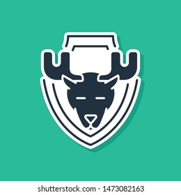 Blue Moose head on shield icon isolated on green background. Hunting trophy on wall.  Vector Illustration
