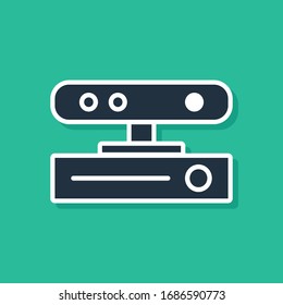Blue Motion sensor icon isolated on green background.  Vector Illustration