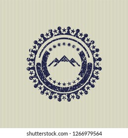 Blue mountain icon inside distress rubber grunge seal