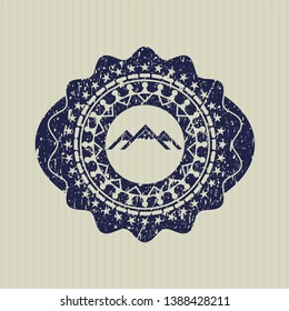 Blue mountain icon inside distressed grunge seal