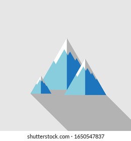 Blue mountain with snow on peak with shadow