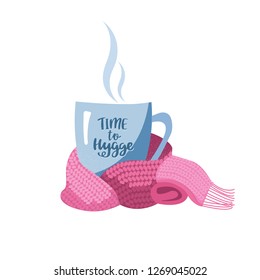 Blue mug with tea or coffee wrapped pink magenta scarf. Hand drawn lettering cup inscription Time to Hygge. Flat cartoon style illustration