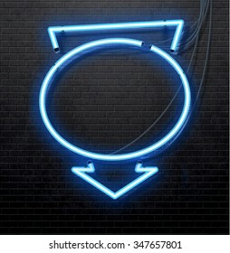 blue neon arrow isolated on black brick wall