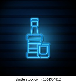 Blue neon sign on dark wall Whiskey bottle with glass. Alcohol concept