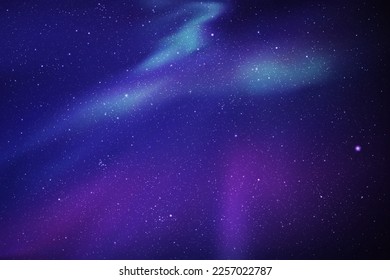 Blue night starry sky and violet polar lights. Indigo aurora borealis