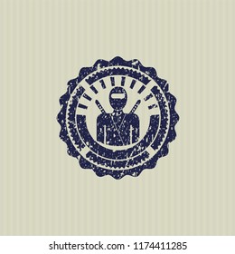 Blue ninja icon inside distress rubber grunge stamp