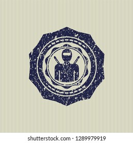 Blue ninja icon inside distress with rubber seal texture