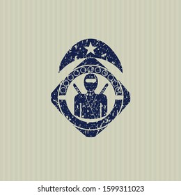 Blue ninja icon inside distress rubber seal with grunge texture