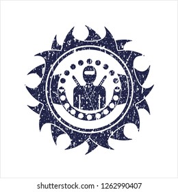 Blue ninja icon inside distressed rubber stamp