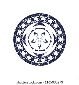 Blue ninja star icon inside distress grunge seal